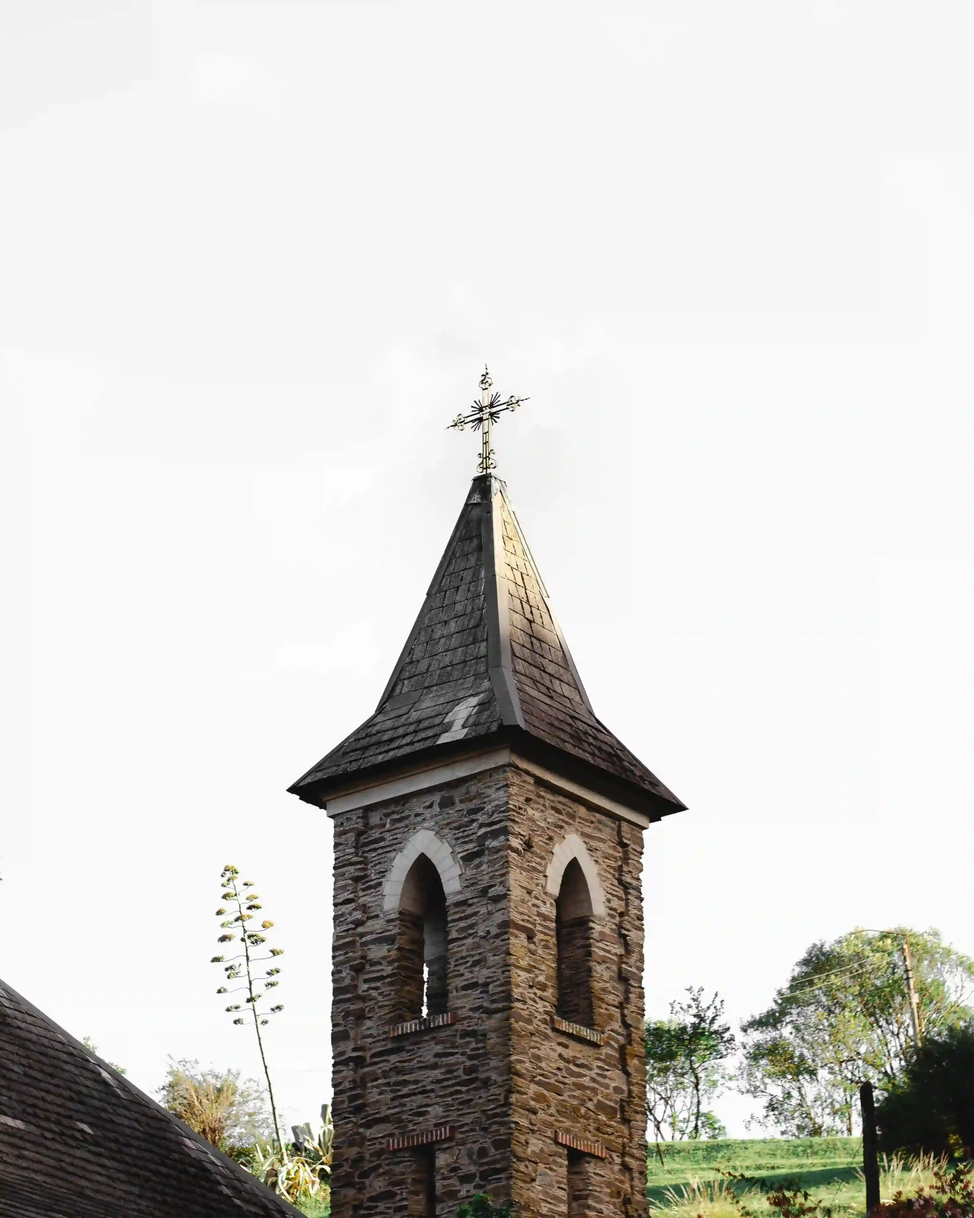 A picture of a church in the mountains.